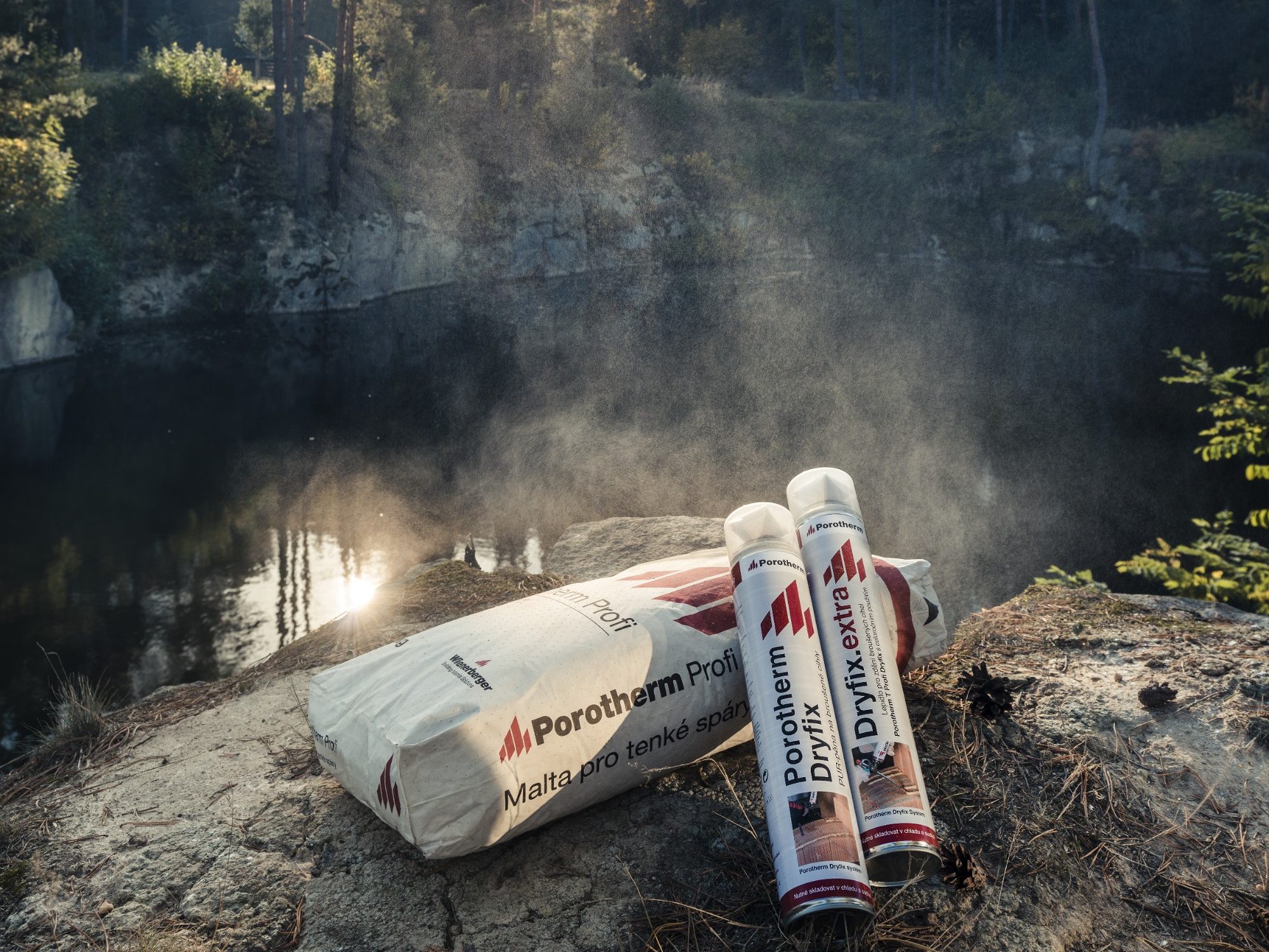 Mortar Porotherm Profi and masonry floam Porotherm Dryfix and glue Dryfix.extra in nature in the background of forest and quarry