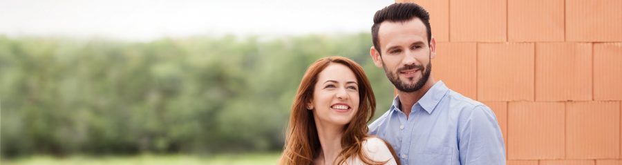 Couple inside their future home inside building shell