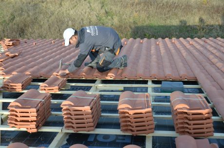 man working on roof, clay tiles, second e4 house