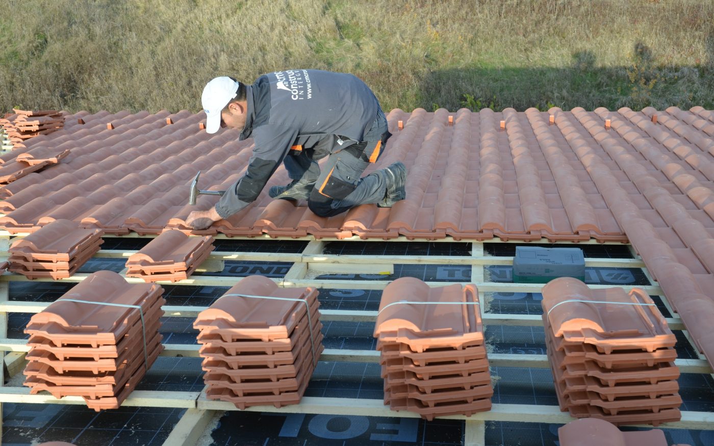 man working on roof, clay tiles, second e4 house